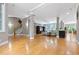 Open-concept living space featuring hardwood floors, natural light, and a comfortable seating area at 120 Wood Lake Dr, Fuquay Varina, NC 27526