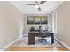 Bright office space with hardwood floors, crown molding, ceiling fan, and large window for natural light at 120 Wood Lake Dr, Fuquay Varina, NC 27526