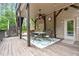 Covered outdoor dining area with seating for six, a ceiling fan, and brick accents at 120 Wood Lake Dr, Fuquay Varina, NC 27526