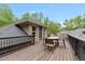 Upper deck with table and chairs, perfect for enjoying the view at 120 Wood Lake Dr, Fuquay Varina, NC 27526