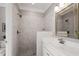 Bathroom featuring a marble tile shower and a white vanity with sink at 121 Cobblepoint Way, Holly Springs, NC 27540