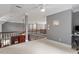 Spacious hallway providing access to various areas of the home's upper level at 121 Cobblepoint Way, Holly Springs, NC 27540