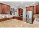 Beautiful kitchen with stone countertops, stainless steel appliances, and ample cabinet space at 121 Cobblepoint Way, Holly Springs, NC 27540