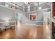 Expansive living area with fireplace, hardwood floors, and large windows at 121 Cobblepoint Way, Holly Springs, NC 27540