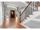 Spacious living room featuring a fireplace and hardwood flooring at 121 Cobblepoint Way, Holly Springs, NC 27540