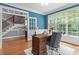 Home office space filled with natural light and hardwood floors at 121 Cobblepoint Way, Holly Springs, NC 27540