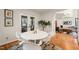 Dining area featuring a modern table with seating, French doors, and an indoor plant at 1213 Blackwood Mountain Rd, Chapel Hill, NC 27516