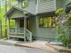 Close-up of the home's exterior, showcasing the porch, landscaping, and architectural style at 1213 Blackwood Mountain Rd, Chapel Hill, NC 27516