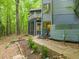 Exterior view of the house which has a screened porch and a balcony at 1213 Blackwood Mountain Rd, Chapel Hill, NC 27516