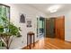 Bright foyer with hardwood floors, stylish decor, and access to the front porch and closet at 1213 Blackwood Mountain Rd, Chapel Hill, NC 27516