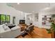 Spacious living room with a fireplace, built-in shelving, and an open floor plan at 1213 Blackwood Mountain Rd, Chapel Hill, NC 27516