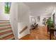Open living area with hardwood floors and a staircase leading to the upper level at 1213 Blackwood Mountain Rd, Chapel Hill, NC 27516