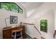 Open office area with desk, chair, modern lighting, and a large window with woodland views at 1213 Blackwood Mountain Rd, Chapel Hill, NC 27516