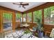This screened porch features rustic wood walls and a view of nature, and includes access to a hot tub at 1213 Blackwood Mountain Rd, Chapel Hill, NC 27516