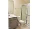 Clean bathroom featuring a glass-enclosed shower, modern sink and vanity, plus tiled flooring at 1240 Grenshaw Dr, Morrisville, NC 27560