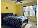 Comfortable bedroom with ceiling fan and natural light from the bright windows at 1240 Grenshaw Dr, Morrisville, NC 27560