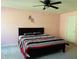Inviting bedroom with large bed, colorful wall decorations, and windows with privacy enhancing curtains at 1240 Grenshaw Dr, Morrisville, NC 27560