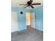 Bedroom with blue walls, neutral carpet, and white doors at 1240 Grenshaw Dr, Morrisville, NC 27560