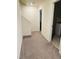 Neutral hallway that leads to an upstairs laundry at 1240 Grenshaw Dr, Morrisville, NC 27560