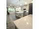 Open-concept kitchen with a center island and views of the living room at 1240 Grenshaw Dr, Morrisville, NC 27560