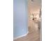 Hallway view of an open-concept living room and kitchen with modern finishes at 1240 Grenshaw Dr, Morrisville, NC 27560