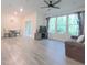 Spacious living room with wood flooring, ample natural light, and comfortable seating area at 1240 Grenshaw Dr, Morrisville, NC 27560