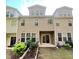 Rear exterior featuring tan siding and a patio at 1240 Grenshaw Dr, Morrisville, NC 27560