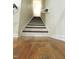 Hardwood stairway with handrail at 1240 Grenshaw Dr, Morrisville, NC 27560