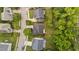 Aerial view of neighborhood showing well-maintained homes, mature trees, and quiet streets at 125 Occidental Dr, Holly Springs, NC 27540