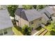 Aerial view of the back of the property featuring a patio, landscaping, and neighboring homes at 125 Occidental Dr, Holly Springs, NC 27540
