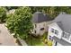 Aerial view of a well-maintained property and neighborhood with mature landscaping at 125 Occidental Dr, Holly Springs, NC 27540