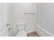 Bright white bathroom featuring a toilet and shower with a sleek, modern design at 125 Occidental Dr, Holly Springs, NC 27540