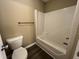 A full bathroom with a standard toilet and tub at 125 Occidental Dr, Holly Springs, NC 27540