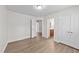Bedroom featuring light wood floors, and a double door closet at 125 Occidental Dr, Holly Springs, NC 27540