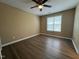 This bedroom has new floors and a ceiling fan at 125 Occidental Dr, Holly Springs, NC 27540