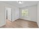 Bedroom with neutral paint and window providing plenty of light at 125 Occidental Dr, Holly Springs, NC 27540