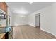 Bright dining room features wood floors and elegant chandelier lighting at 125 Occidental Dr, Holly Springs, NC 27540