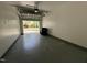 Spacious garage with epoxy flooring and automatic door leading to the outdoors at 125 Occidental Dr, Holly Springs, NC 27540