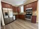 Well-equipped kitchen with stainless steel appliances, stylish cabinets, and granite countertops at 125 Occidental Dr, Holly Springs, NC 27540