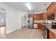Modern kitchen with stainless steel appliances, granite countertops, and wood cabinets at 125 Occidental Dr, Holly Springs, NC 27540