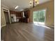Spacious kitchen with stainless steel appliances, cherry cabinets, and a view of the backyard at 125 Occidental Dr, Holly Springs, NC 27540