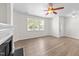 Spacious living room with ceiling fan and windows at 125 Occidental Dr, Holly Springs, NC 27540