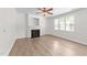 Cozy living room with decorative fireplace and plenty of natural light at 125 Occidental Dr, Holly Springs, NC 27540
