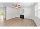 Bright living room with decorative fireplace and natural light at 125 Occidental Dr, Holly Springs, NC 27540