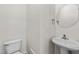 Charming powder room with pedestal sink and modern fixtures at 125 Occidental Dr, Holly Springs, NC 27540