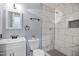 Bathroom featuring updated vanity, tiling in shower, and modern fixtures and finishes at 1317 Proctor St, Rocky Mount, NC 27801
