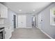 View from the kitchen into the hallway with white trim and fresh paint at 1317 Proctor St, Rocky Mount, NC 27801