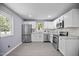 Modern kitchen with stainless steel appliances, white cabinetry, and gray countertops at 1317 Proctor St, Rocky Mount, NC 27801