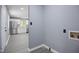 Laundry area with easy access to kitchen with light gray walls and flooring at 1317 Proctor St, Rocky Mount, NC 27801