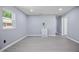 Bright living room with new gray flooring, fresh paint, and natural light at 1317 Proctor St, Rocky Mount, NC 27801